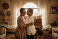 Black South African mother and daughter sharing a loving embrace in a Soweto home