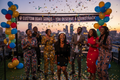 Black South African friends celebrating a birthday at a Johannesburg rooftop party